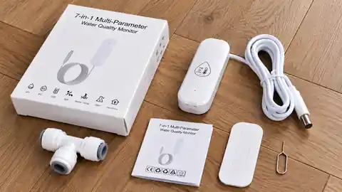 Contenu de la boîte du Tuya ZG-109TDS disposé sur un parquet