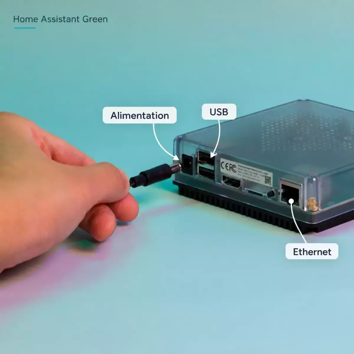 Boîtier Home Assistant Green avec repères français sur alimentation, USB et Ethernet